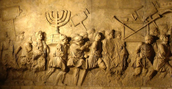 Image on the triumphal arch of emperor Titus: The temple treasures are being carried to Rome